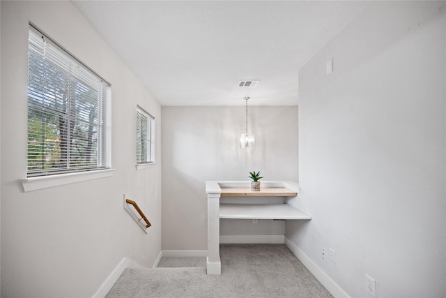 bathroom featuring a notable chandelier