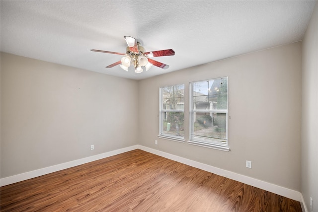 unfurnished room with ceiling fan and light hardwood / wood-style floors