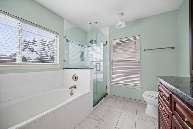 full bathroom featuring tile patterned flooring, vanity, toilet, and independent shower and bath