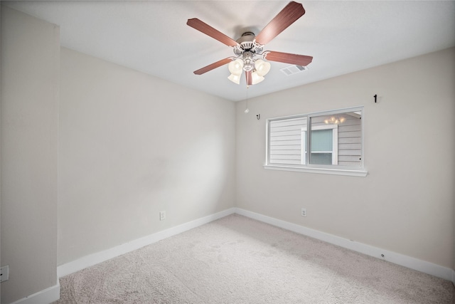 spare room with carpet and ceiling fan