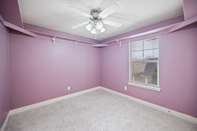 carpeted empty room with ceiling fan