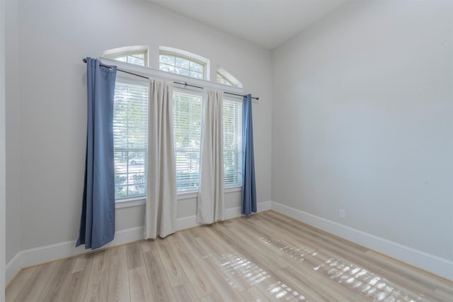 spare room with light hardwood / wood-style floors