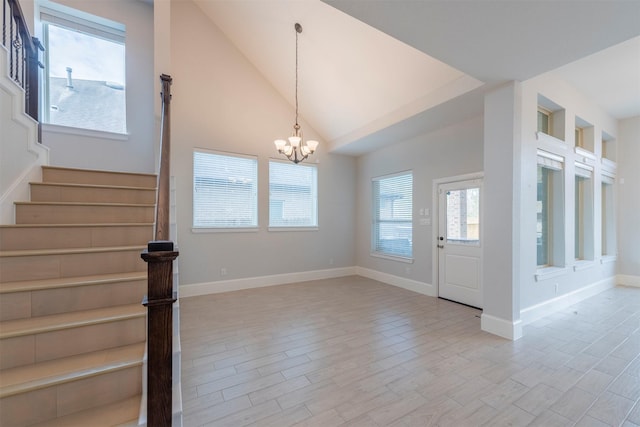 interior space featuring vaulted ceiling and an inviting chandelier