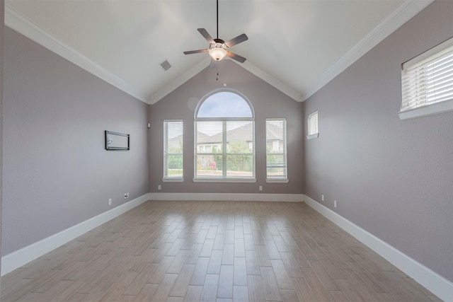 unfurnished room featuring ceiling fan, crown molding, and vaulted ceiling