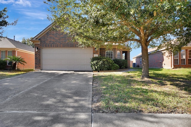 view of front of home featuring a front yard and a garage