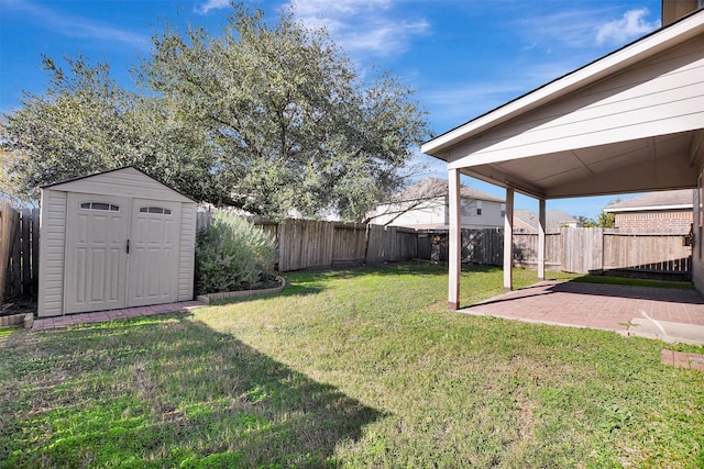 view of yard with a patio area and a storage unit