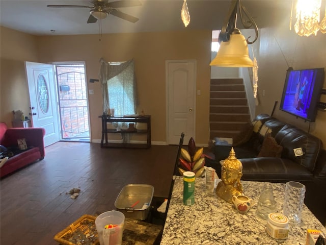 living room featuring ceiling fan and dark hardwood / wood-style floors