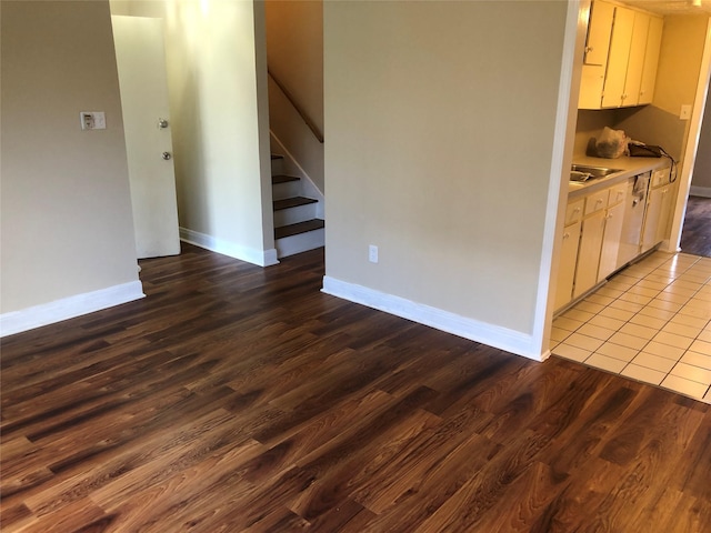 kitchen featuring dark hardwood / wood-style flooring and sink