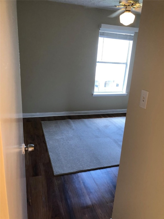 spare room featuring ceiling fan and wood-type flooring