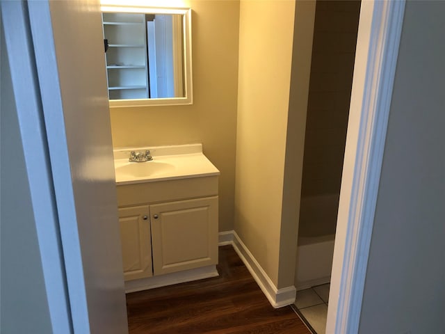 bathroom featuring vanity and hardwood / wood-style flooring