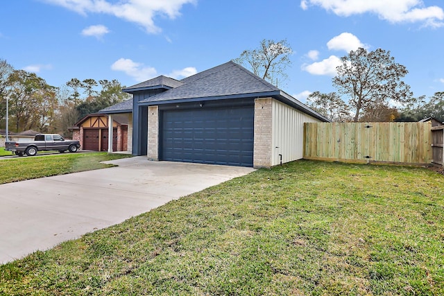 view of property exterior featuring a lawn and a garage