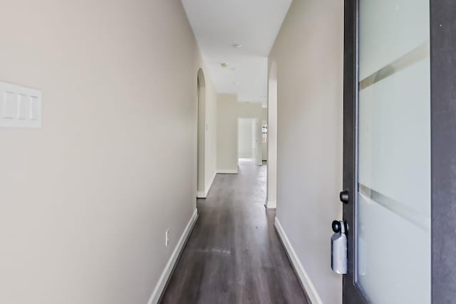 corridor with dark wood-type flooring