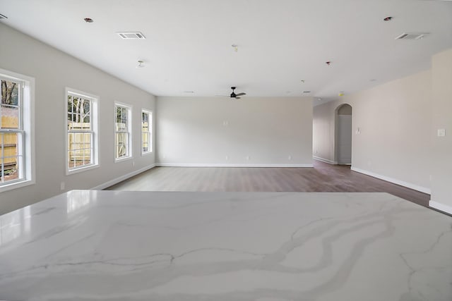 unfurnished room featuring light hardwood / wood-style floors and ceiling fan