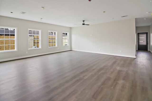 unfurnished room with hardwood / wood-style flooring and ceiling fan