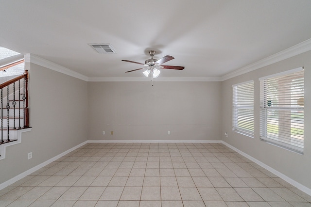 tiled spare room with ceiling fan and crown molding