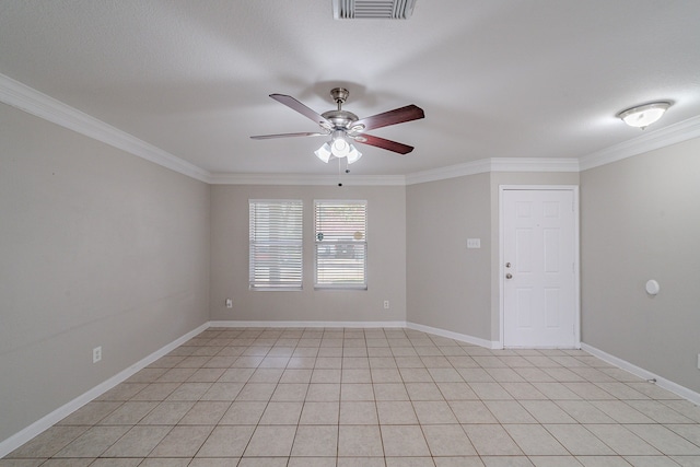 tiled spare room featuring ceiling fan and crown molding