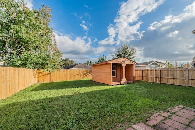 view of yard with a storage shed