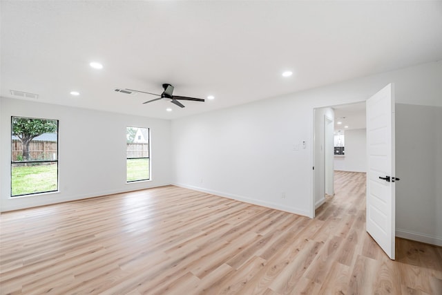 unfurnished room with ceiling fan and light wood-type flooring