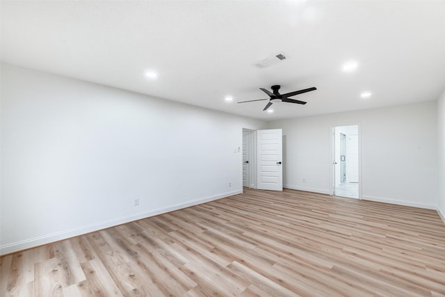 spare room featuring ceiling fan and light hardwood / wood-style flooring