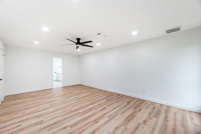 empty room featuring light hardwood / wood-style flooring and ceiling fan