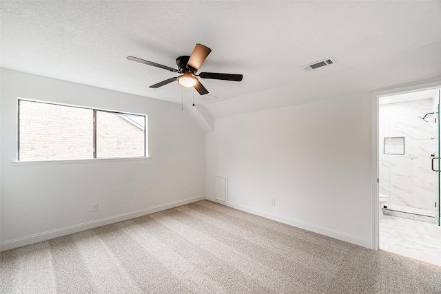 spare room with ceiling fan and carpet floors