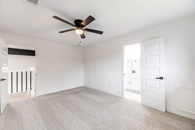 carpeted empty room with ceiling fan