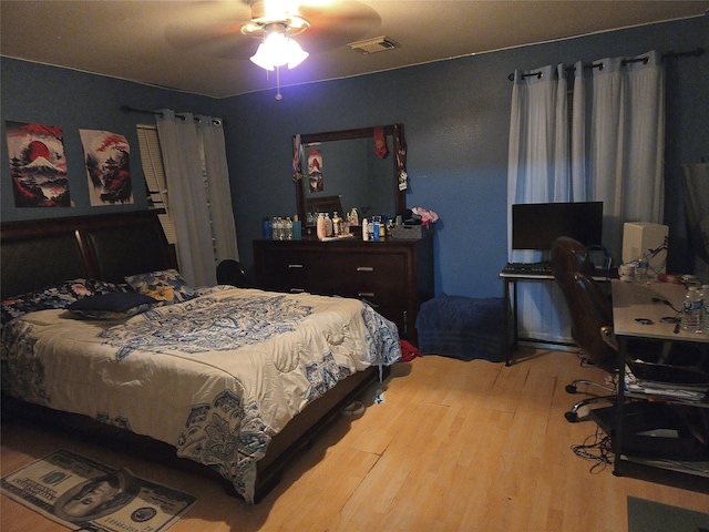 bedroom featuring ceiling fan and wood-type flooring