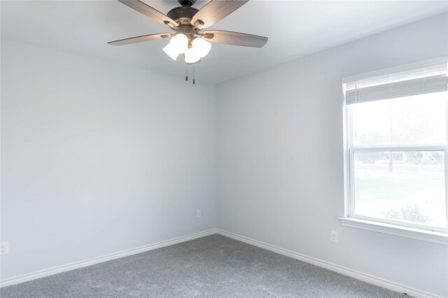 empty room featuring ceiling fan and carpet floors