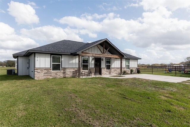 craftsman inspired home featuring central AC, a patio, and a front lawn