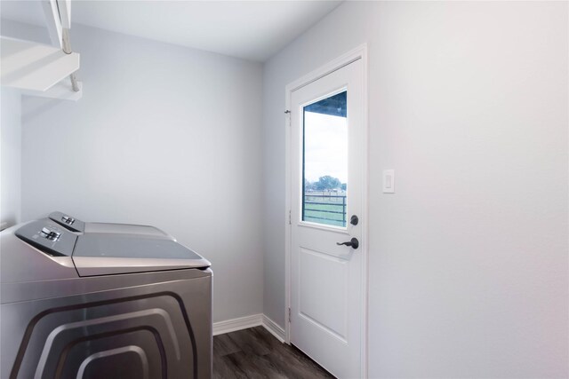 washroom with washer and clothes dryer and dark hardwood / wood-style floors