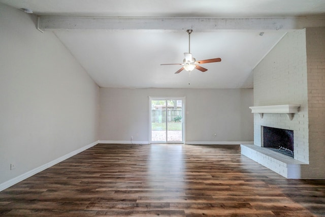 unfurnished living room featuring ceiling fan, lofted ceiling with beams, dark hardwood / wood-style floors, and a brick fireplace