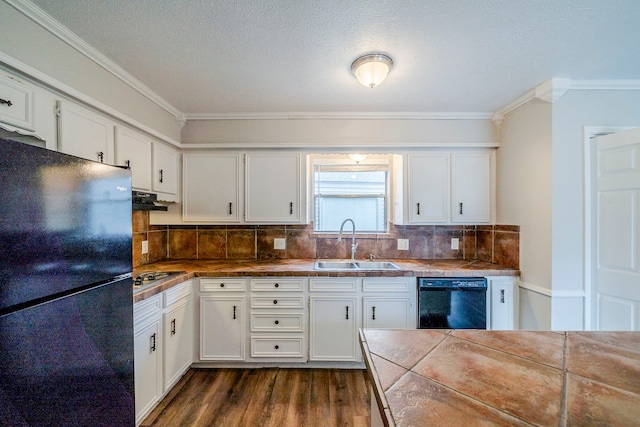 kitchen with black appliances, sink, tile counters, dark hardwood / wood-style flooring, and white cabinetry