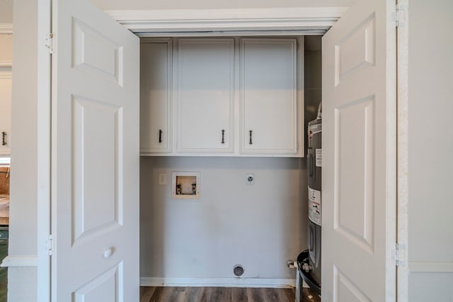 laundry room featuring electric dryer hookup, cabinets, hookup for a washing machine, water heater, and dark hardwood / wood-style flooring