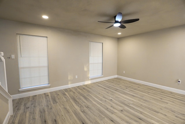 unfurnished room featuring light wood-type flooring and ceiling fan