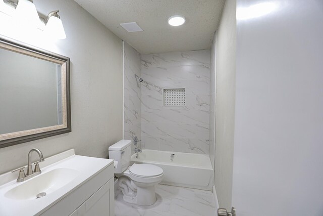 full bathroom featuring vanity, tiled shower / bath combo, and toilet