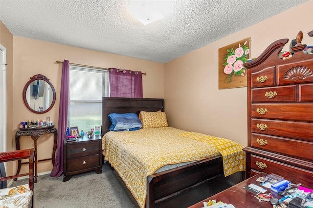 carpeted bedroom with a textured ceiling