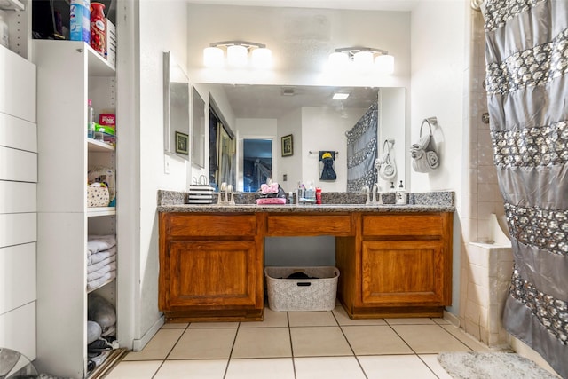 bathroom featuring tile patterned flooring and vanity