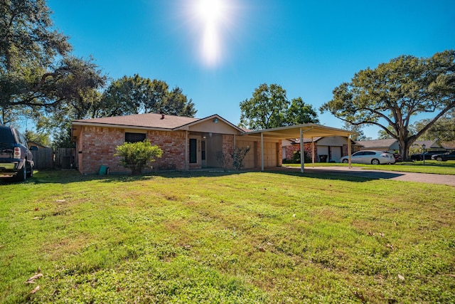 ranch-style home featuring a front lawn and a carport