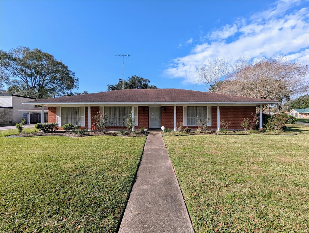 ranch-style house with a front lawn