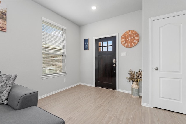 entryway with light hardwood / wood-style flooring