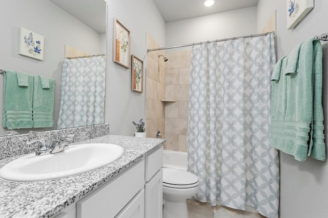 full bathroom with vanity, toilet, and shower / bath combo with shower curtain