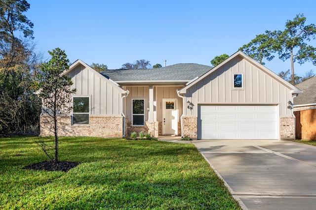 view of front of property featuring a garage and a front lawn