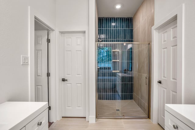 bathroom with vanity and walk in shower