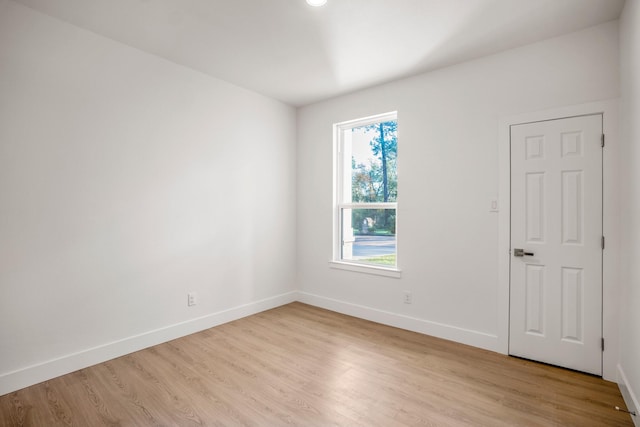 spare room featuring light wood-type flooring