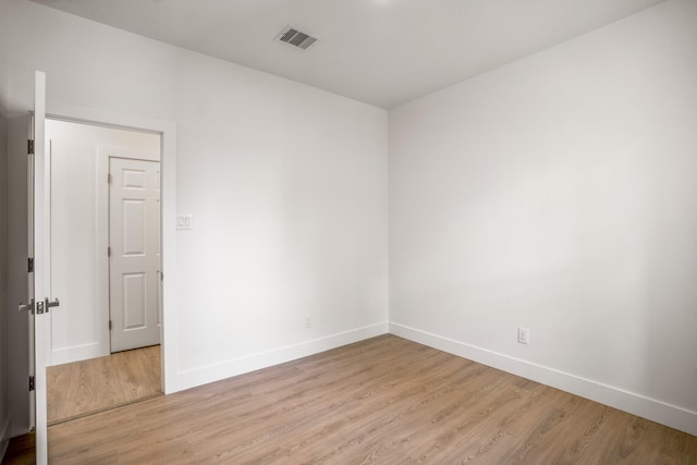 empty room with light hardwood / wood-style floors