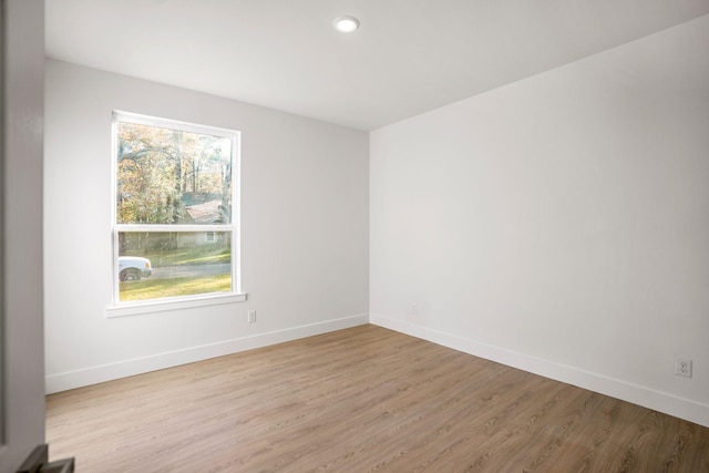 empty room with light hardwood / wood-style floors