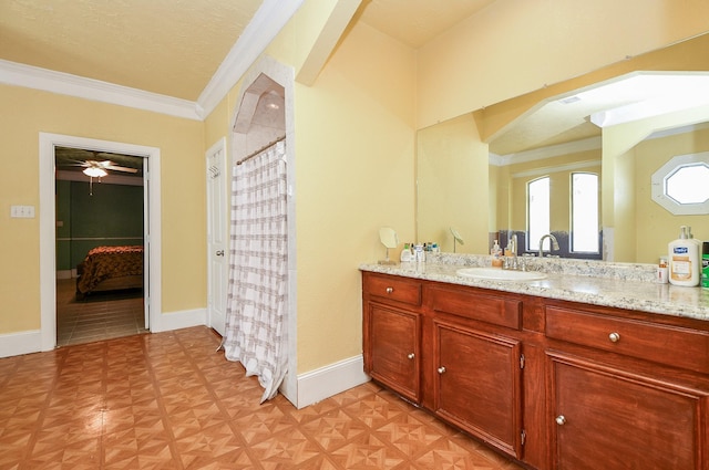 bathroom with vanity, crown molding, and parquet flooring