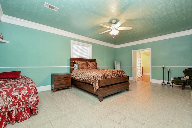 bedroom featuring ornamental molding, a textured ceiling, and ceiling fan