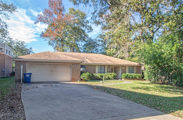 ranch-style home featuring a garage and a front lawn