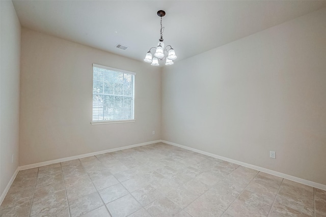 unfurnished room with an inviting chandelier